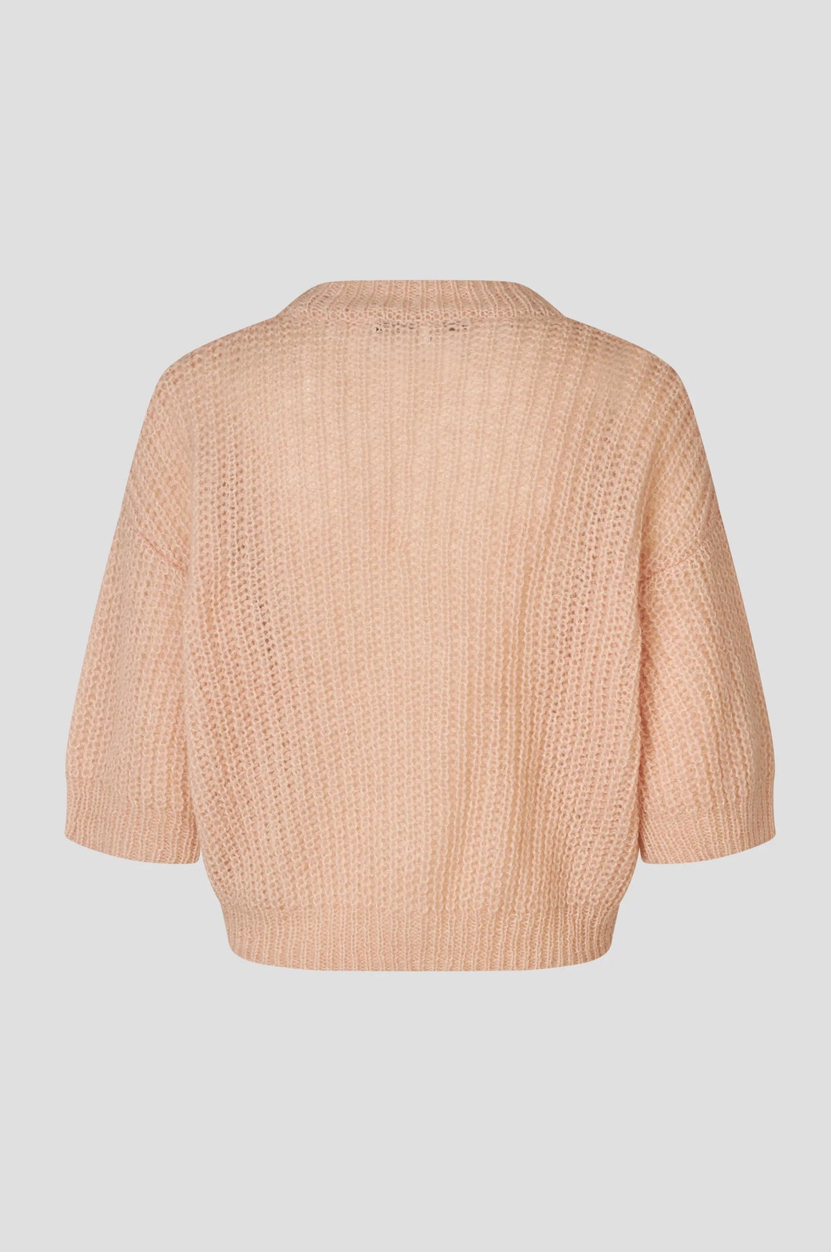 Rear view of short sleeve open weave pale pink knit