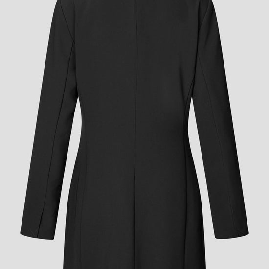 A black longline blazer dress shown from the back, featuring a structured collar and long sleeves, photographed against a solid light gray background.