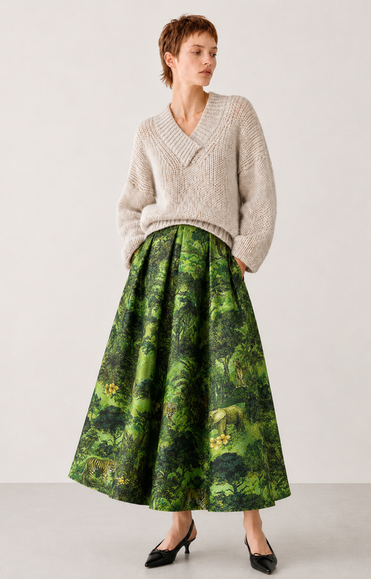 model shot of a green statement skirt and a beige piece of knitwear 