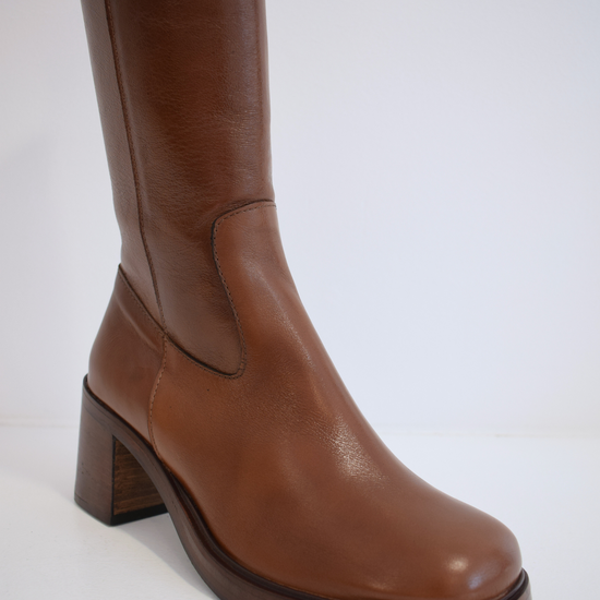 Chestnut brown medium length boot with round toe woodne block heel and wooden platform sole with inner zip fastening