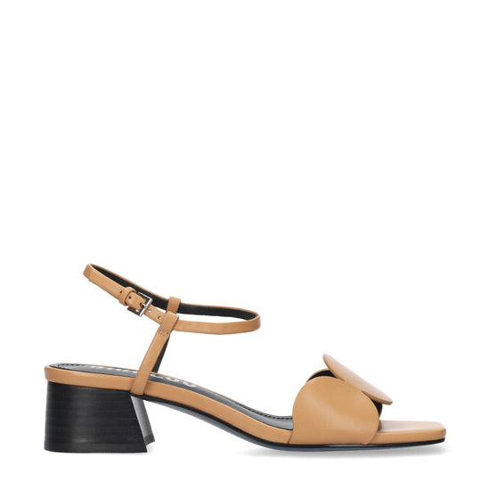 Tan sandal with a black heel on a white background