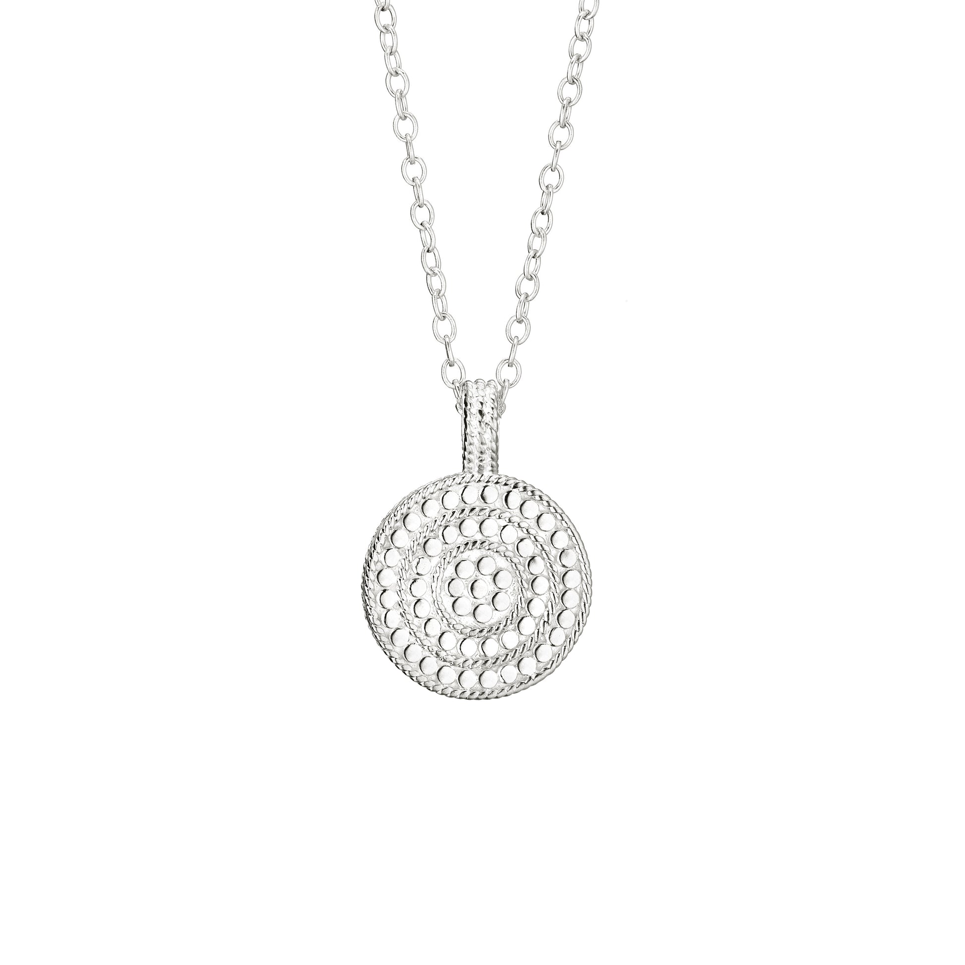 Silver necklace with a circular pendant on a white background