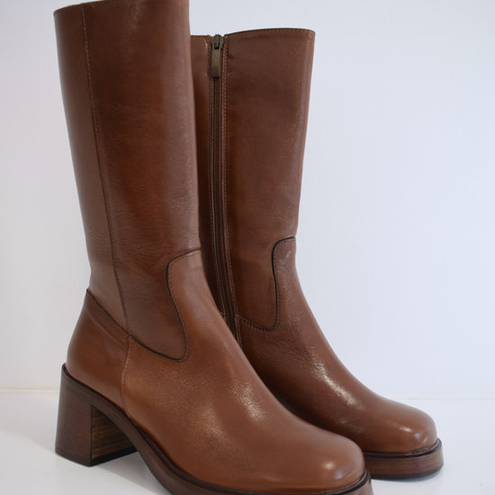 Chestnut brown medium length boot with round toe woodne block heel and wooden platform sole with inner zip fastening