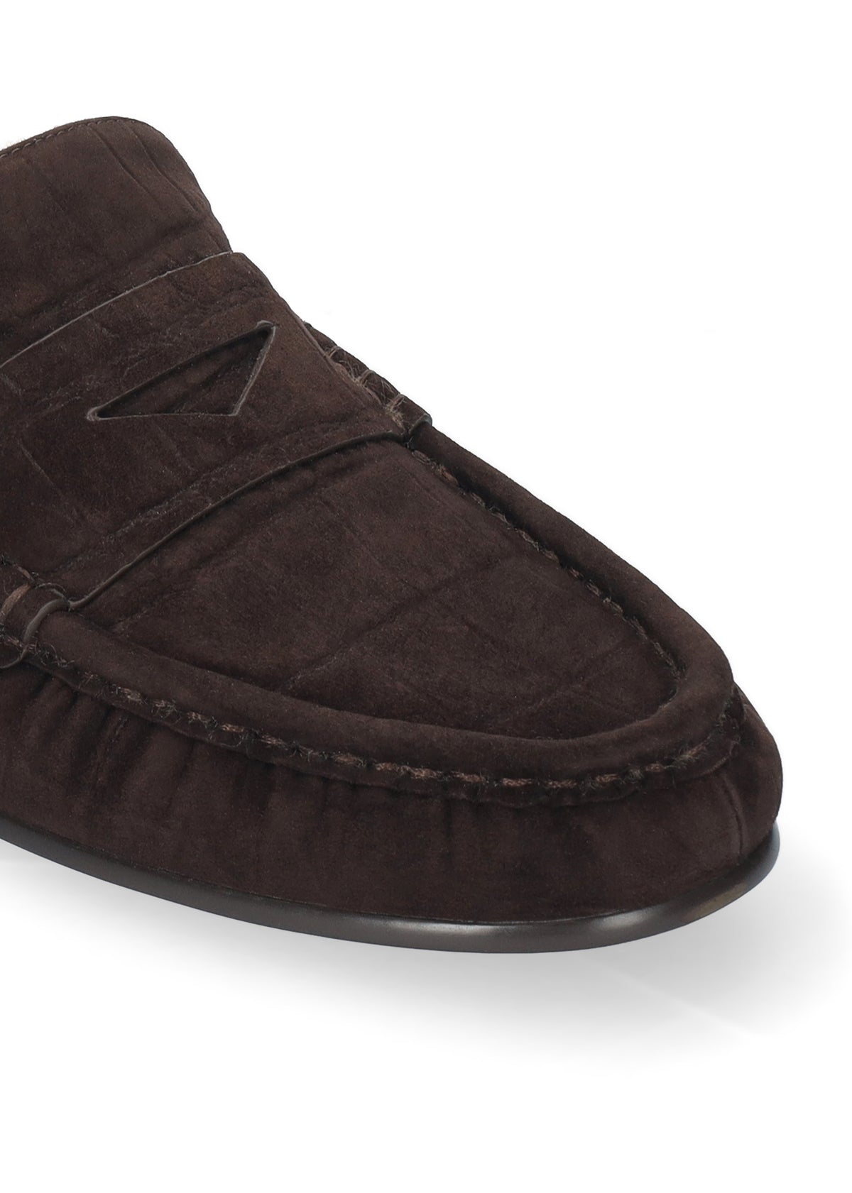 A close-up shot of a dark brown suede moccasin loafer on a clean white background.