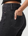 wide leg black jeans with raw hem and high waist close up