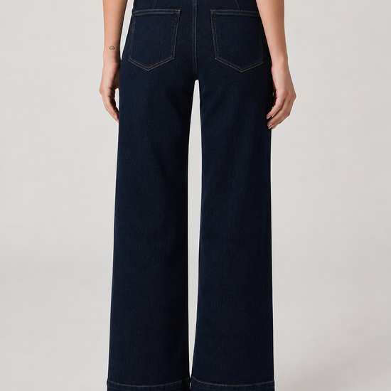 model shot of the back of a dark denim pair of jeans on a plain white background 