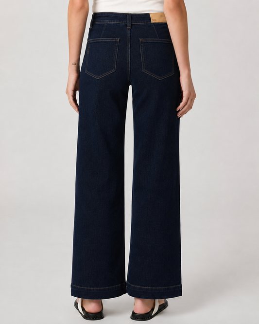 model shot of the back of a dark denim pair of jeans on a plain white background 