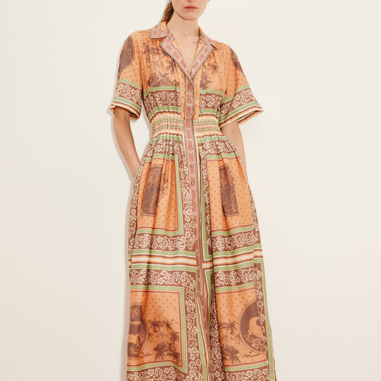 smocked waist elbow length sleeve maxi dress with colourful pattern from alemais