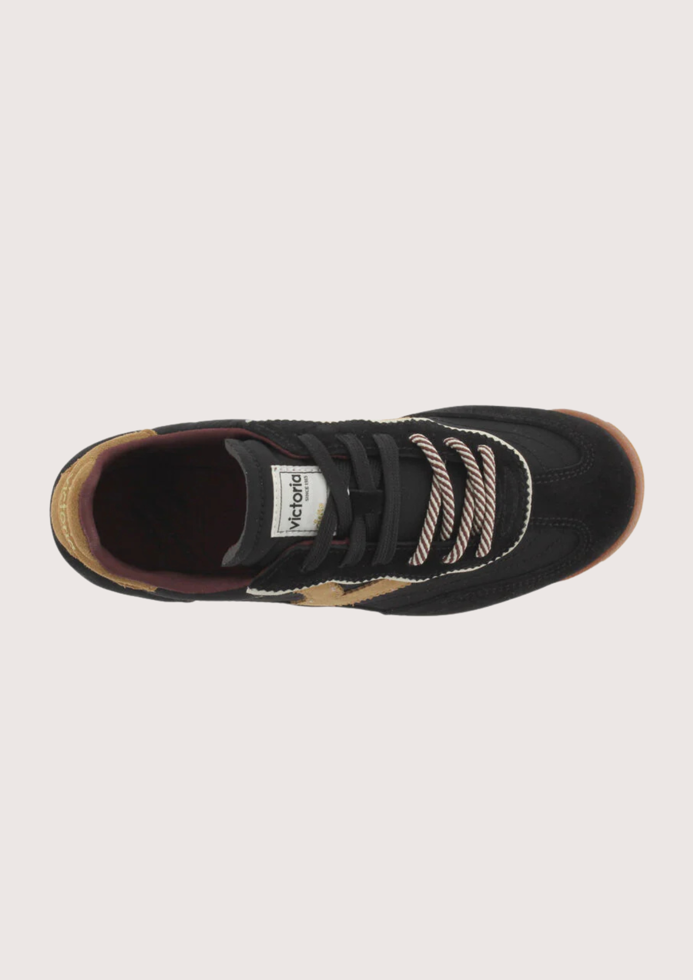 A black suede and mesh low-top sneaker with tan side panels, burgundy lining, and a cream midsole, shown from a side profile on a light gray background.