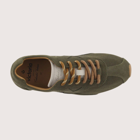 Khaki suede sneaker with beige sole on a plain background