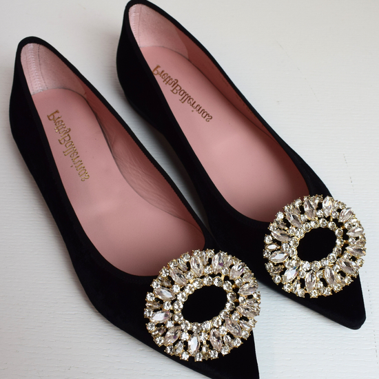 Black velvet pointed toe ballet pumps with gold and diamante brooch on toe