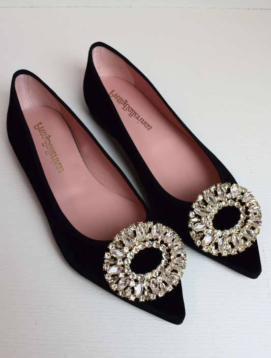 Black velvet pointed toe ballet pumps with gold and diamante brooch on toe