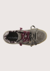 A low-top platform sneaker in dark gray suede and leather, featuring a thick beige gum sole, gray laces, and burgundy ribbon laces tied in a bow.