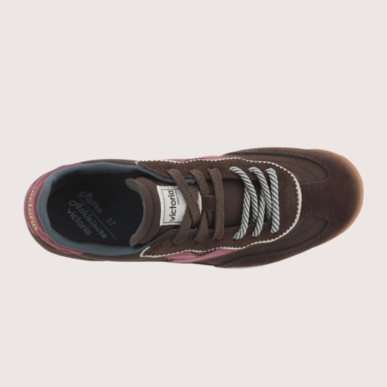 A dark brown suede and mesh sneaker with burgundy accents, featuring a cream midsole and a gum outsole, shown from a side profile on a light gray background.