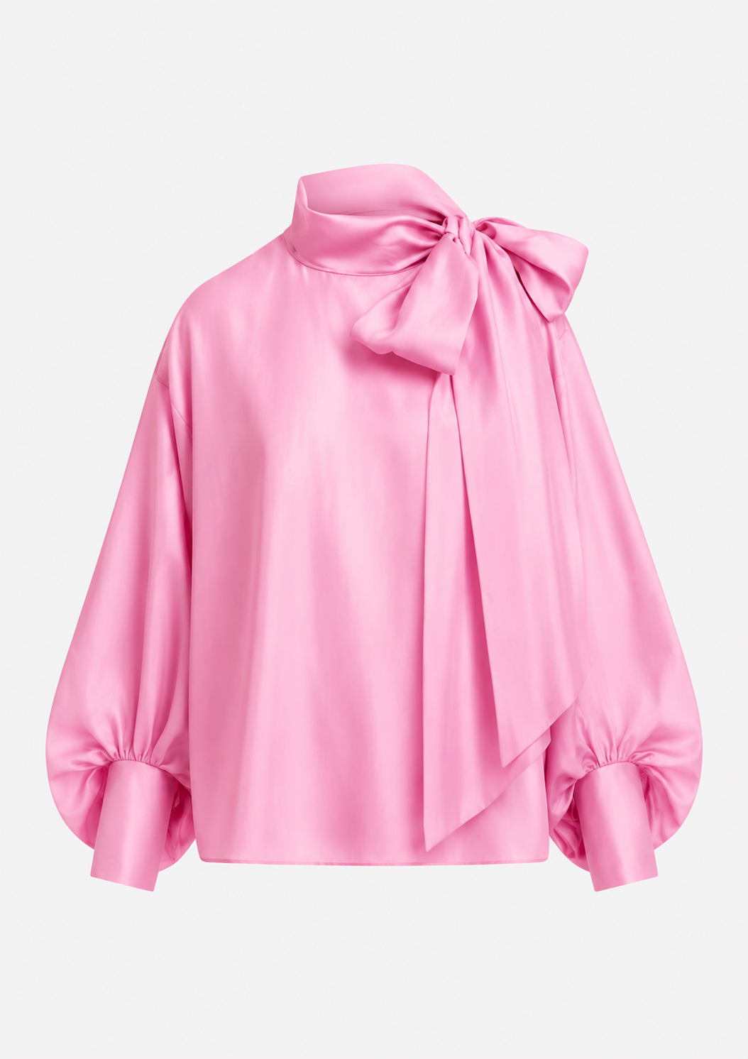 A pink satin blouse with a large bow at the high neck, balloon sleeves, and gathered cuffs, shown on a plain light gray background.