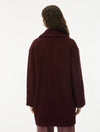 A model shown from the back wearing a textured, fuzzy dark burgundy coat against a plain white background.