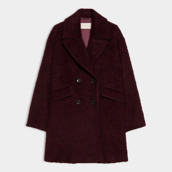 A dark burgundy double-breasted coat with a textured bouclé-like finish, displayed flat against a light gray background.