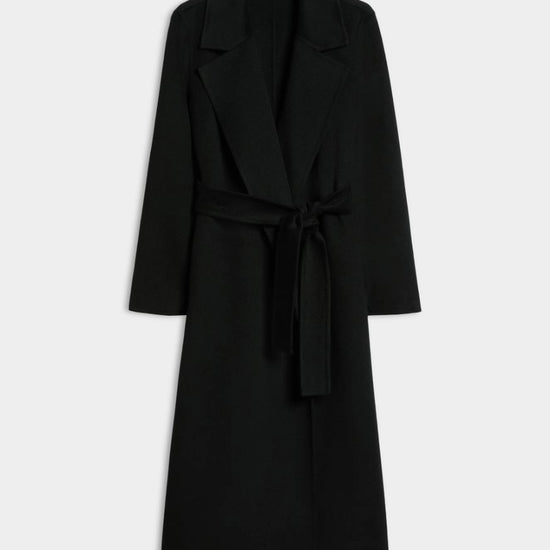 A black long coat with a tie belt, shown on a plain light gray background.