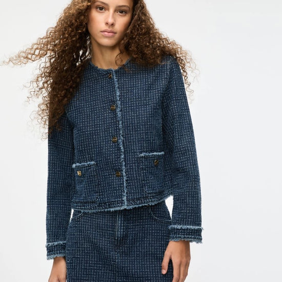 denim blue round neck jacket with gold buttons and frayed edging from iblues model shot