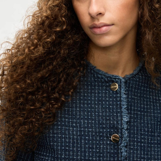 denim blue round neck jacket with gold buttons and frayed edging from iblues close up