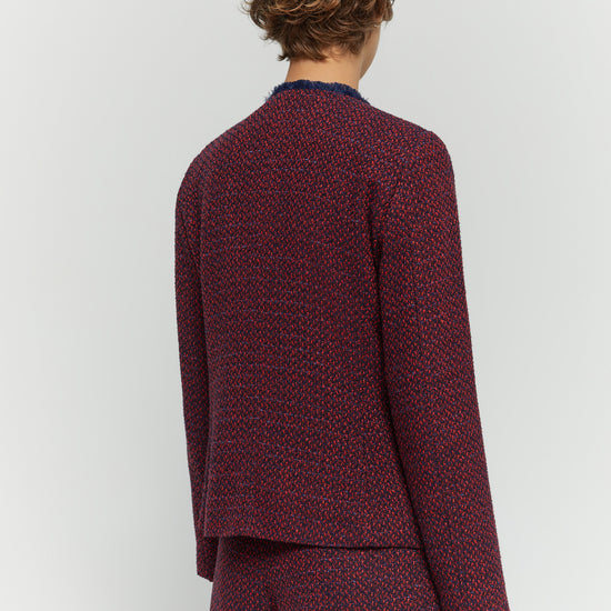 Rear view of red and navy woven jacket