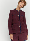 Model shot of woven jacket with gold toned buttons paired with matching short