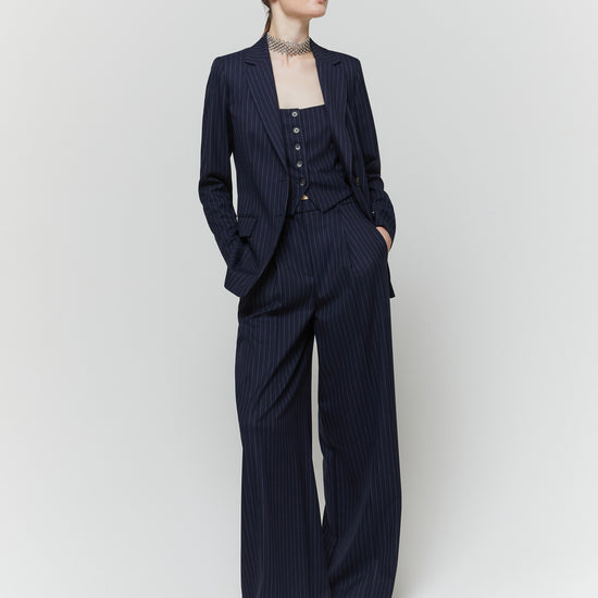 Navy blazer on moel worn with matching trousers