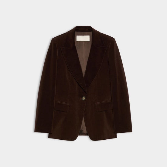 A dark brown velvet blazer with notched lapels and a single button closure, displayed flat against a light gray background.