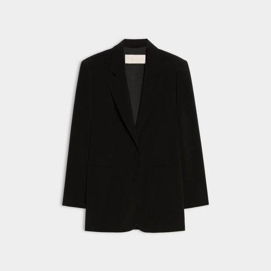 A black long-sleeve blazer with notch lapels, displayed flat against a light gray background.