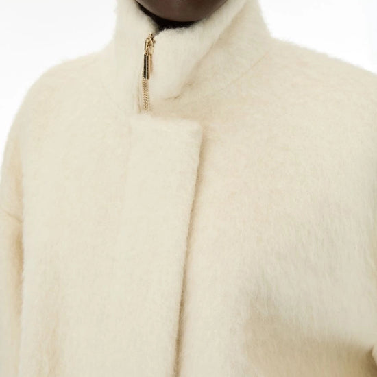 Close up of cream jacket 
