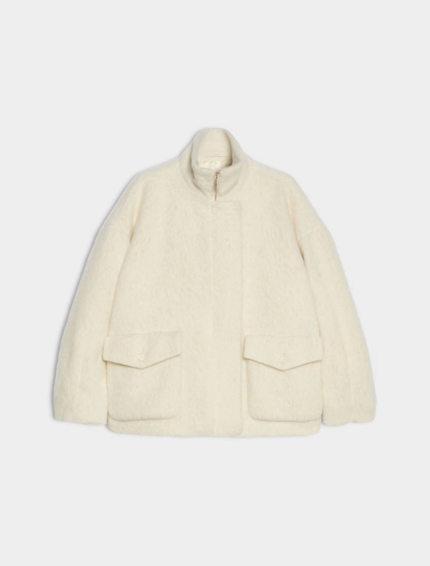 An off-white textured fleece jacket with a stand-up collar, front zipper, and two large flap pockets, shown against a light gray background.