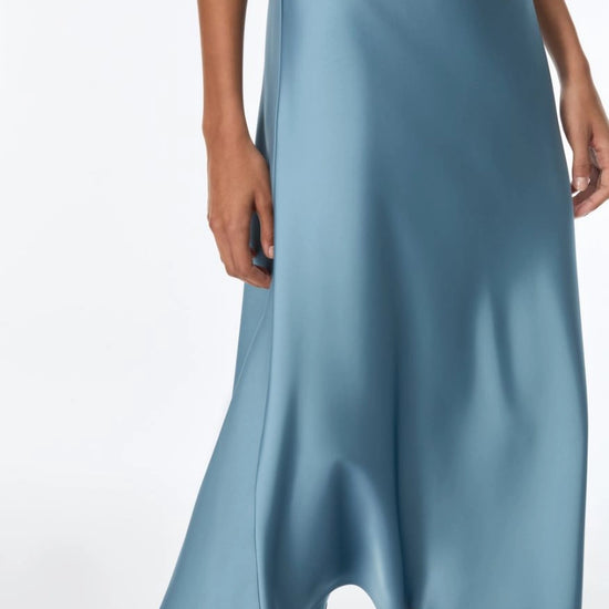 woman wearing light blue satin skirt 