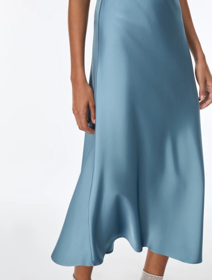 woman wearing light blue satin skirt 
