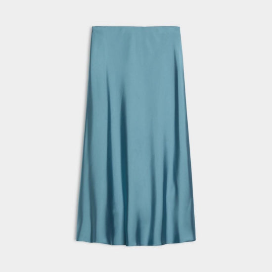 light blue satin skirt on white background