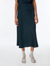 woman wearing teal blue skirt eith silver heels 