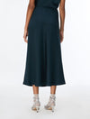 woman wearing teal blue skirt with silver heels rear view