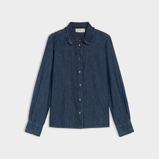 Blue denim shirt on a light gray background