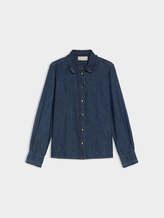 Blue denim shirt on a light gray background