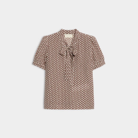 geometric blouse with neck tie on white background