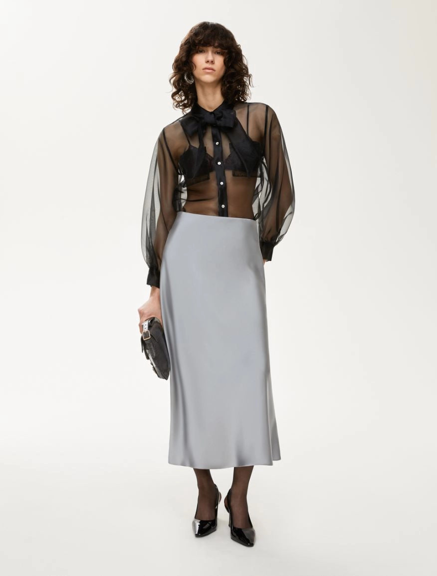 black sheer blouse with tie neck, long puffy sleeves and chest pockets model shot