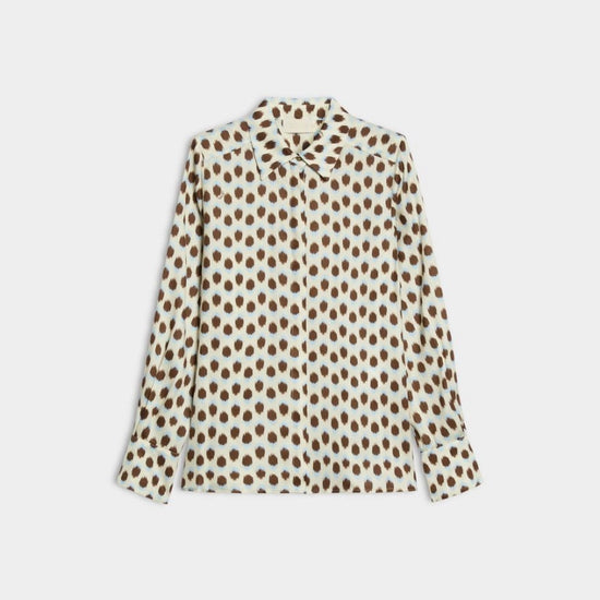 blue and brown spotted shirt on white background