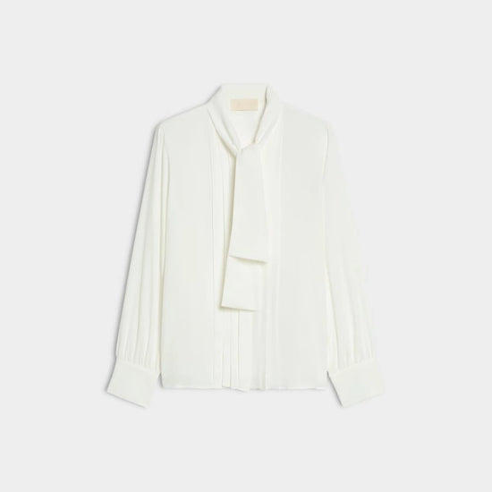 white blouse with neck tie on white background