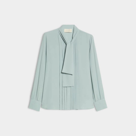 green blouse with neck tie on white background 