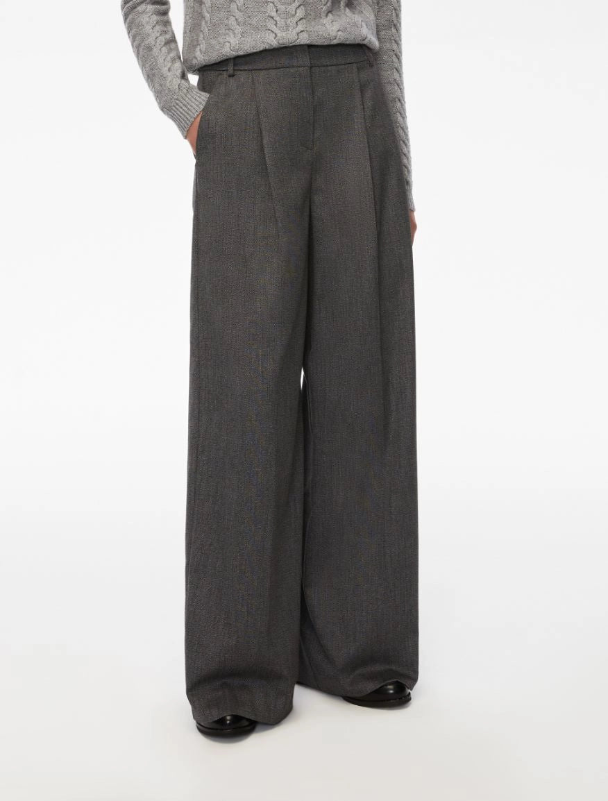 Person wearing gray wide-leg pants on a white background from iBlues
