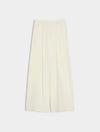 A pair of off-white wide-leg cropped trousers with a high waist and front pleats, displayed flat against a light gray background.
