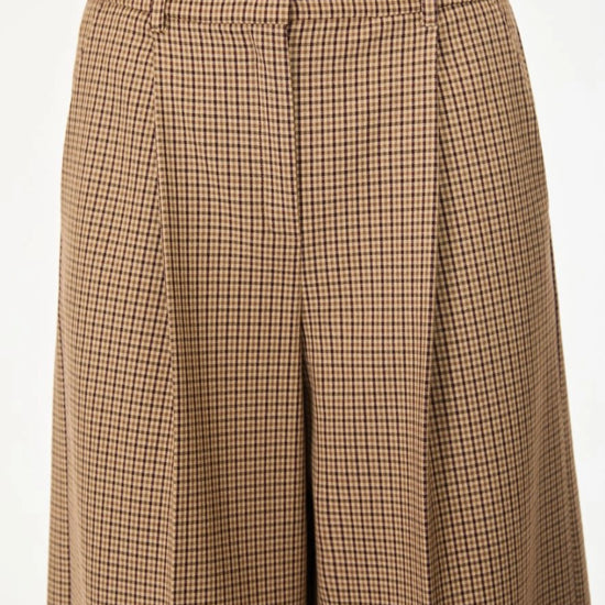 Brown check wide leg trousers on a white background close up