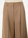Brown check wide leg trousers on a white background close up