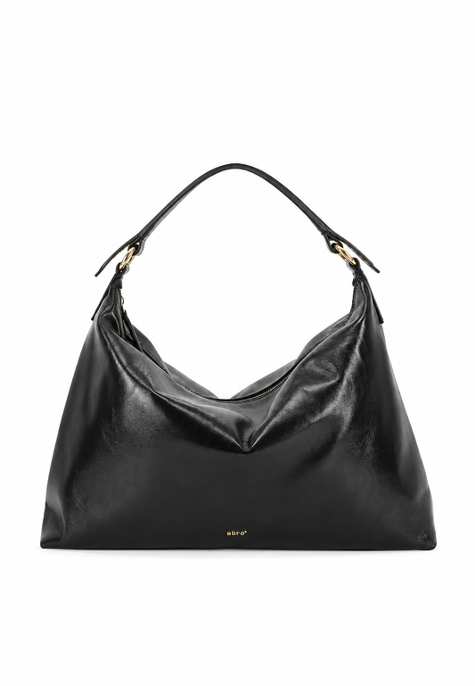 A black leather slouchy hobo handbag with gold-tone hardware and a single shoulder strap, photographed against a plain white background.