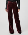 Close up of dark red velvet trousers