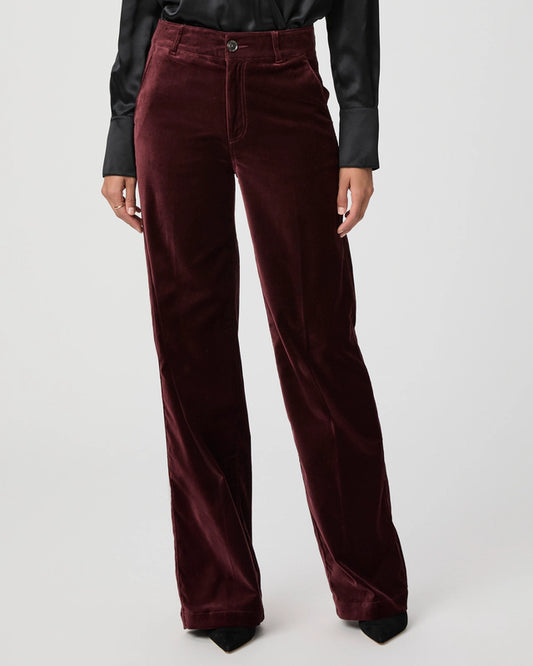 Close up of dark red velvet trousers